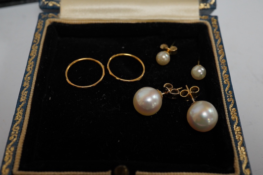 Three pairs of cultured pearl stud earrings, largest 9.3mm diameter, a pair of sleeper earrings, a gold and cultured pearl flower head pendant, stamped 9ct, with a gilt metal chain